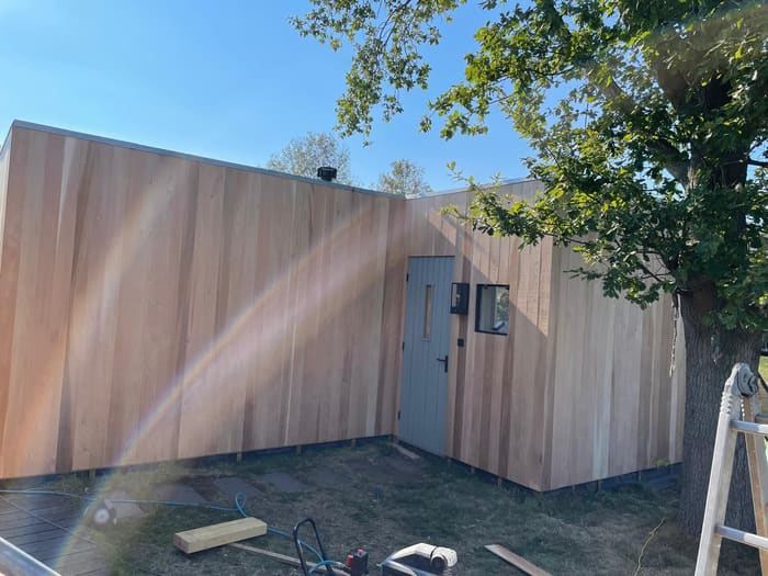 Houten gevelbekleding, bijgebouw, Watergang